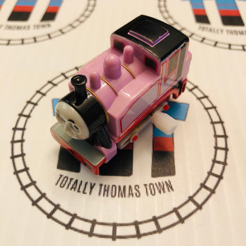 Rosie the pink Thomas the train on a wooden railroad Stock Photo